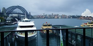Sydney Harbour Bridge and Opera House on an overcast day.